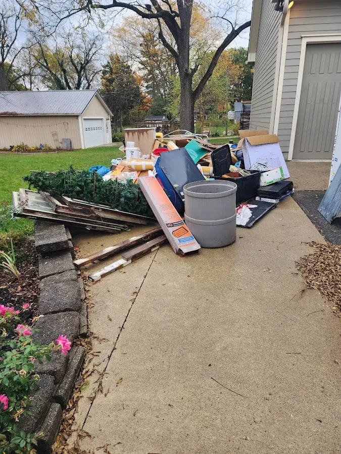 Dumpster being loaded with debris for Commercial Dumpster Rental in Vandergrift